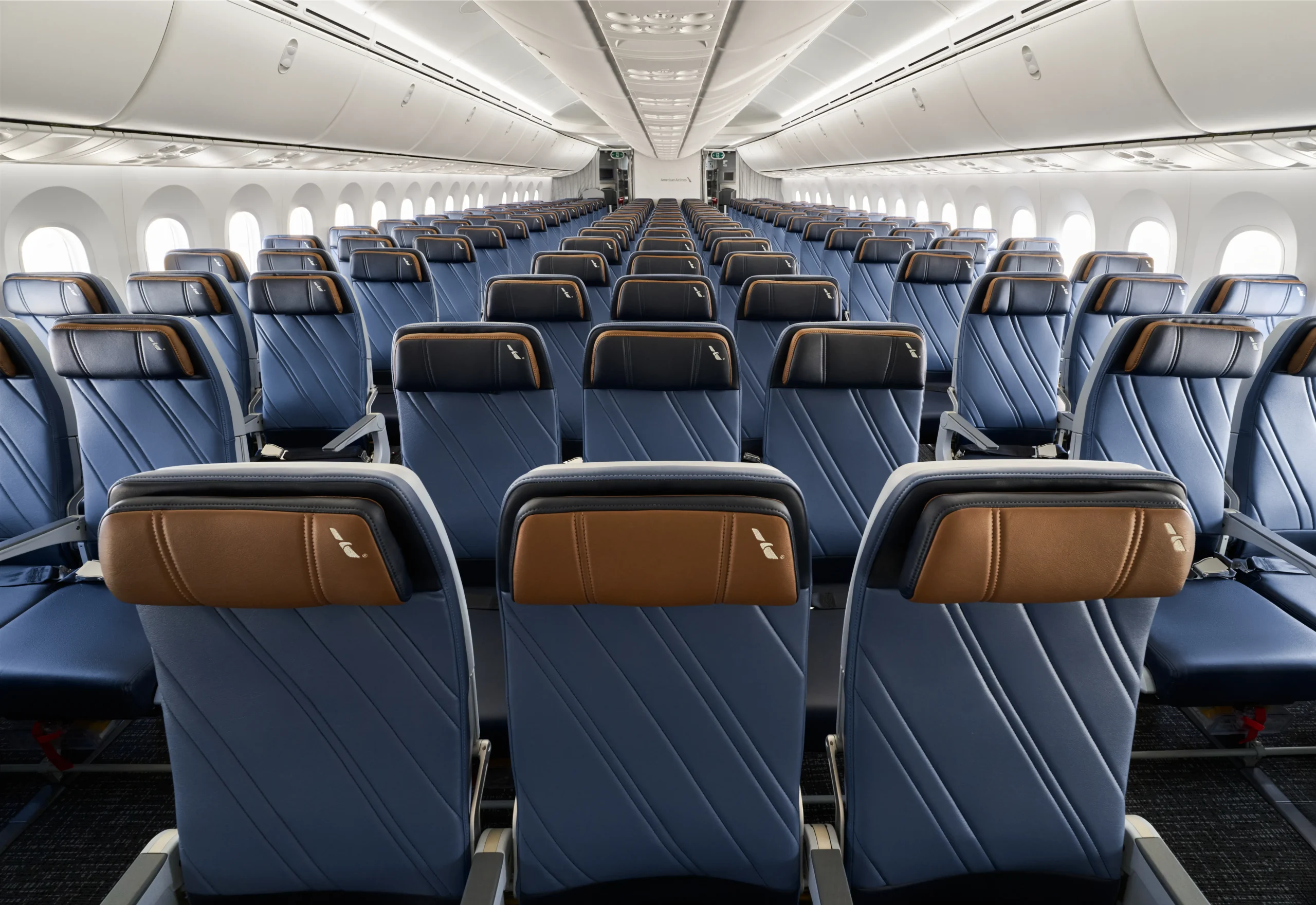 Commercial airline economy cabin during high-demand summer travel